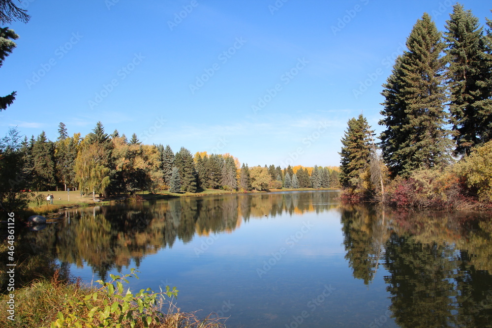 autumn trees reflected in water, William Hawrelak Park, Edmonton, Alberta