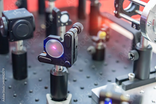 Experiment with laser device in optical laboratory