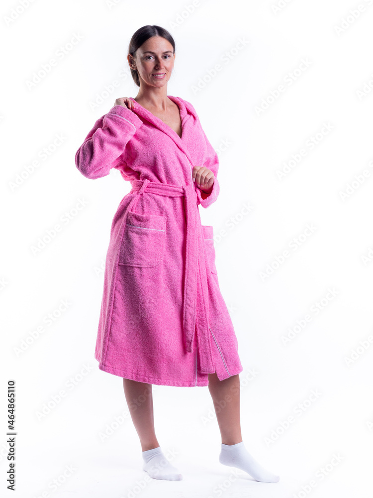 woman in a Bathrobe on an isolated white background with a smile on her face. woman in a Bathrobe on an isolated white background with a smile on her face.