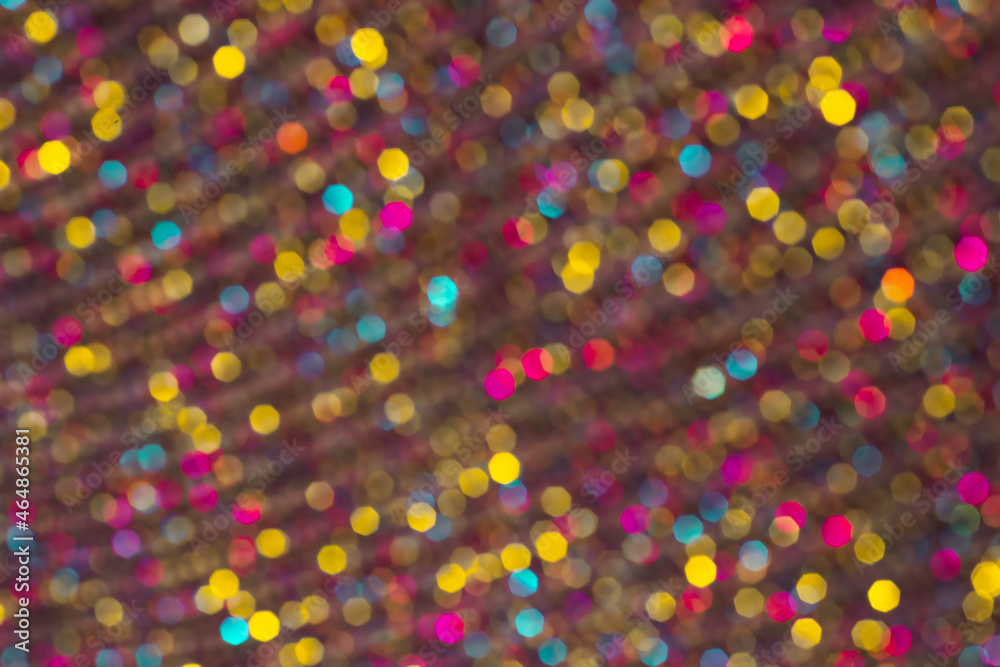 Diwali holiday lighs. Golden yellow, blue, pink soft-focus lights close up. Bright Colorful festive happy bokeh pattern.