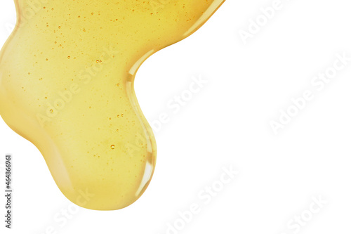 Yellow texture of a drop of whey or olive oil on a white background. Transparent sample of cosmetic gel with bubbles. Golden acid cream. Vitamin c. A drop of honey. Hyaluronic acid.