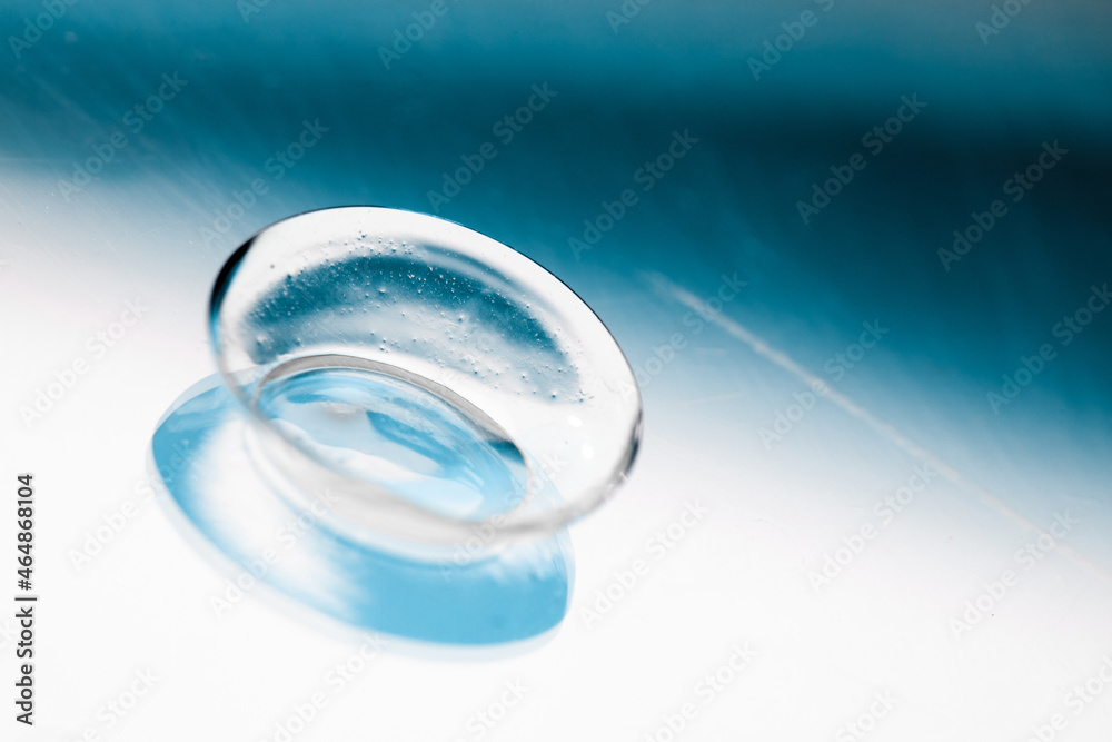 contact lenses on blue backgroundn close up view - Image contact lenses on blue backgroundn close up view - Image