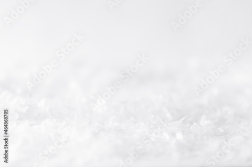White soft light delicate abstract snow texture with snowflakes  closeup  blur band. Abstract winter snowy background.