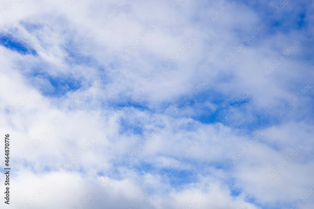 Obraz premium Natural abstract background - blue sky and white clouds.
