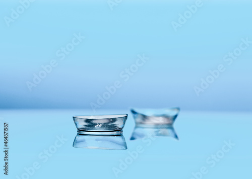 contact lenses on blue background close up view - Image © Fototocam