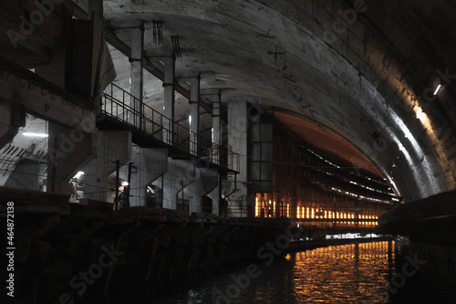 Illuminated industrial concrete tunnel perspective