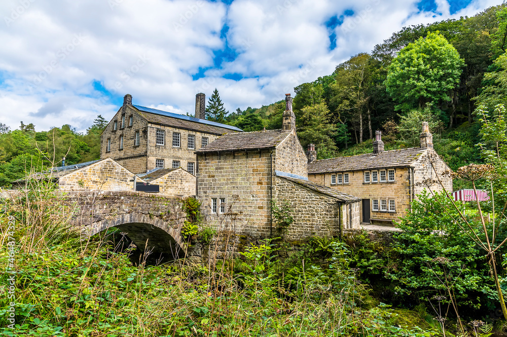 A view towards an old mill on the outskirts of Hebden Bridge, Yorkshire, UK in summertime