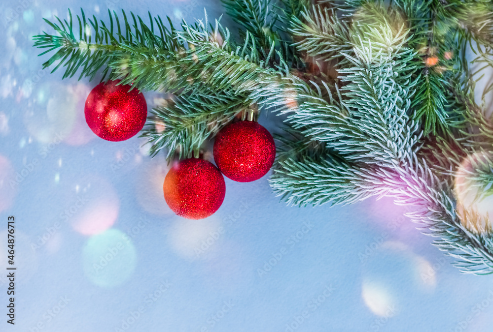 Christmas fir tree with decoration on a wooden board. Copy space. Selective focus.