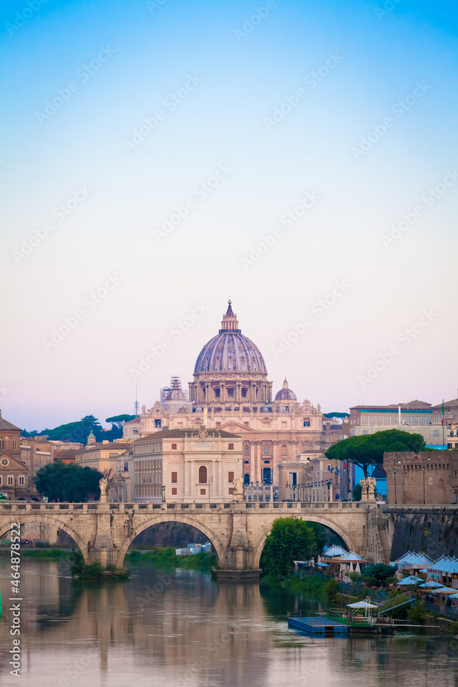 Sunset on Tiber river bridge with Vatican City - Rome, Italy