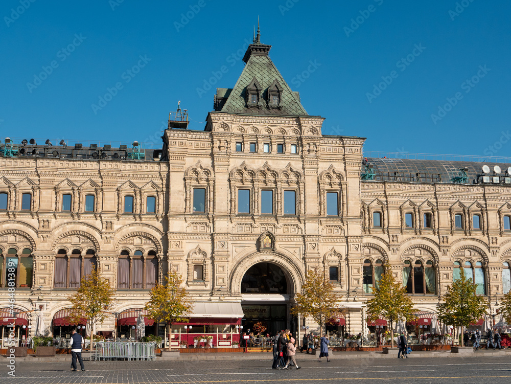 Moscow, Russia - October 5, 2021: Red Square. View of the GUM building, a large shopping center. People walk near the main entrance to GUM.