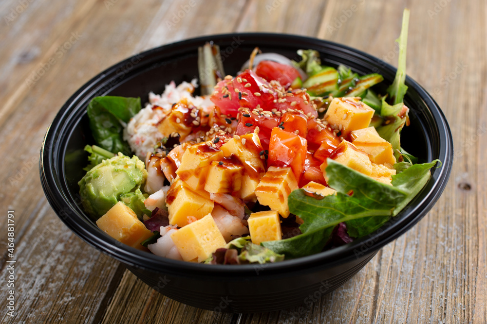 A view of a poke bowl, featuring ahi and tamagoyaki. A view of a poke bowl, featuring ahi and tamagoyaki.