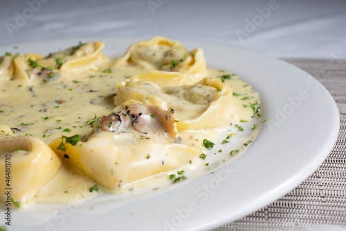 A view of a plate of tortellacci.