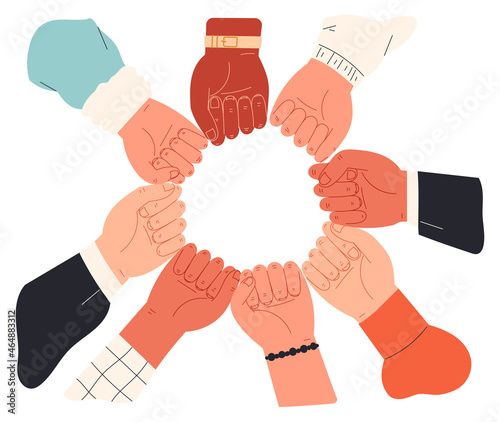 People putting their fists together in circle.