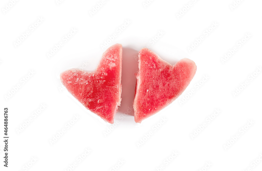 Frozen fresh tuna steaks in the shape of a heart. Isolated on white background. View from above. Fish food concept