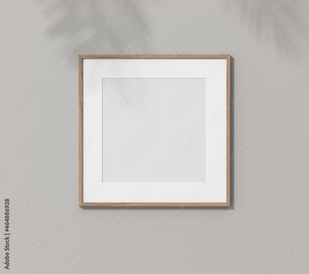 Square wooden frame with passe partout on white wall. 3D render wooden frame mock up in the empty interior. 3D illustrations. Shadow on the wall. Place for your text. Template for design. Square wooden frame with passe partout on white wall. 3D render wooden frame mock up in the empty interior. 3D illustrations. Shadow on the wall. Place for your text. Template for design.