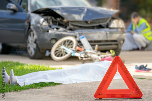 Картината върху платно EMERGENCY SCENE OF A TRAFFIC ACCIDENT SIMULATION BETWEEN CAR AND BICYCLE WITH DEADLY HURT