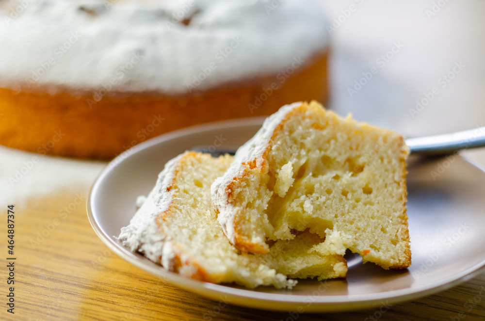 Portion of Madeira ring loaf cake served on a small plate Portion of Madeira ring loaf cake served on a small plate