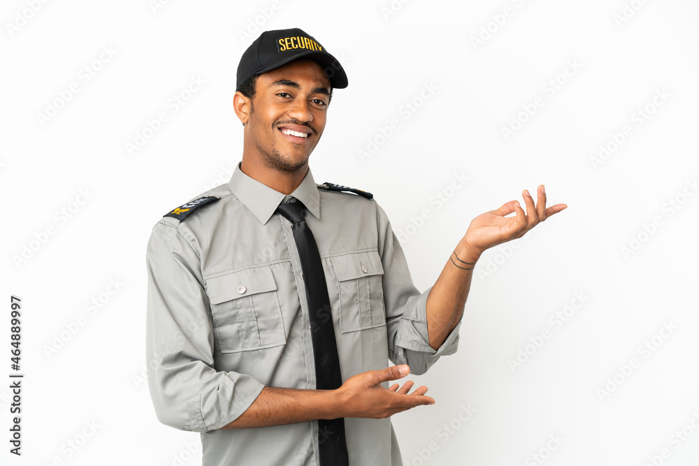 African American safeguard over isolated white background extending hands to the side for inviting to come African American safeguard over isolated white background extending hands to the side for inviting to come