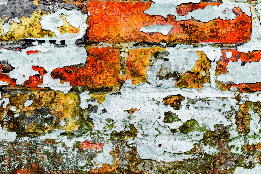 Fototapeta premium Texture of a brick wall with cracks and scratches which can be used as a background