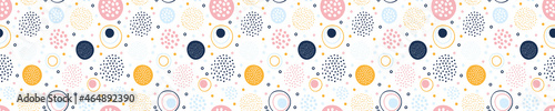 Abstract geometric seamless pattern with circles and dots.