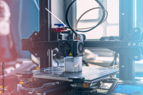 Obraz na płótnie The 3D printer prints white transparent plastic model