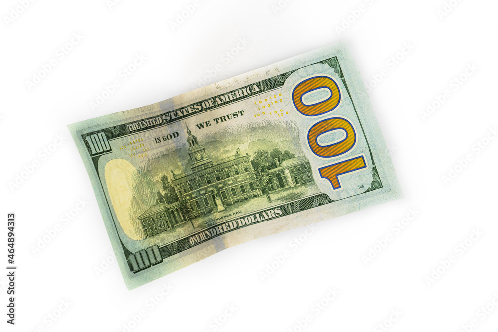 A paper bill with a face value of one hundred dollars on a white background. Close-up. A paper bill with a face value of one hundred dollars on a white background. Close-up.