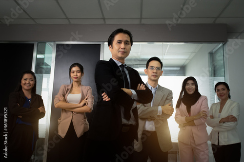 Smart confident leader with success and confident happy teamwork various culture members standing line stack at front meeting room  Teamwork of Employee  Business vision  Leadership concept