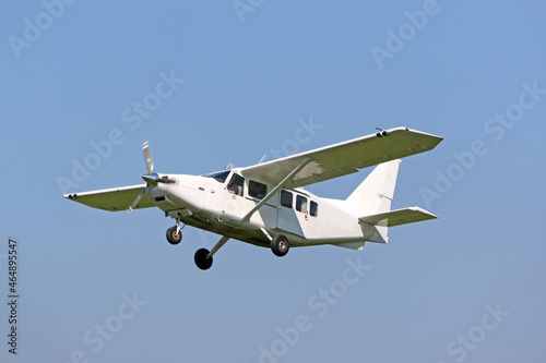 Ultralight airplane flying in a blue sky 