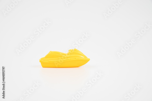 Yellow plastic toy boat.