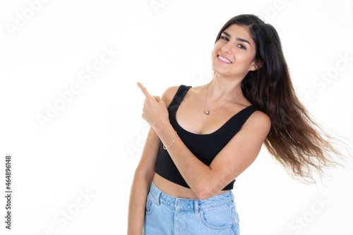 happy dynamic young brunette woman showing presenting blank empty copy space isolated on white background