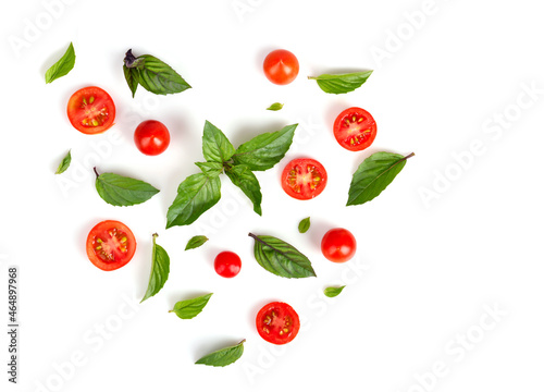 Flat lay of tomatoes and green basil