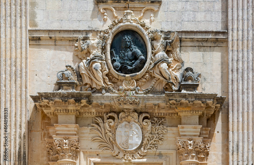 Vilhena Palace main portico including bronze bust of Grand Master Antonio Manoel de Vilhena, with his coat of arms carved in marble below, Mdina, Malta. photo