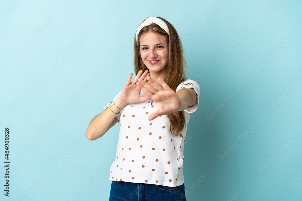 Young caucasian woman over isolated background nervous stretching hands to the front Young caucasian woman over isolated background nervous stretching hands to the front
