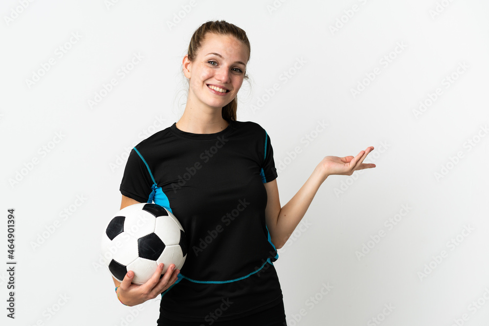 Young football player woman isolated on white background extending hands to the side for inviting to come