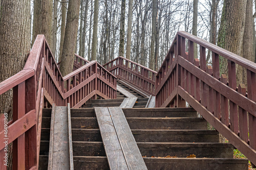 Fototapeta Naklejka Na Ścianę i Meble -  Wooden staircase with railings in the city park
