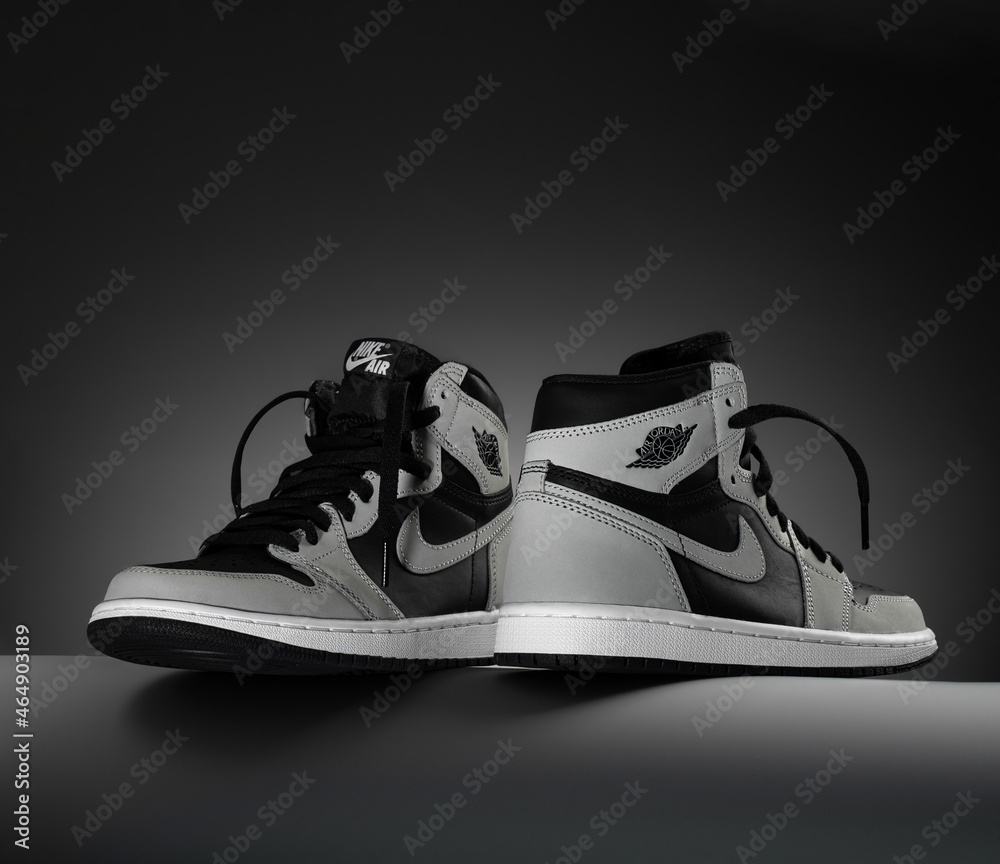 24.10.2021. Sneakers black grey Air Jordan 1 Retro High OG Shadow 2.0, dark  background. concept photo for shoes store. copy space Stock Photo | Adobe  Stock