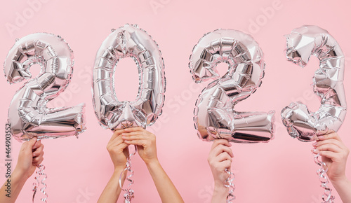 Photography Festive balloons in from the numbers 2023 on a pink background.