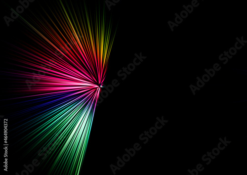 Abstract surface of blur radial zoom in blue, pink and yellow tones on a black background. Bright multicolored background with radial, diverging, converging lines .
