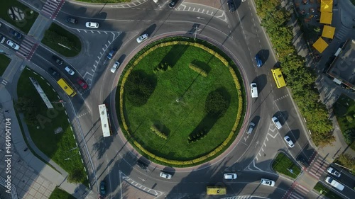 Top view of traffic of people, cars and buses at rush hour at circular junction