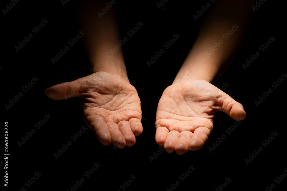 Two hands with open palms turned up, offering or giving something, a handful. Two hands with open palms turned up, offering or giving something, a handful.