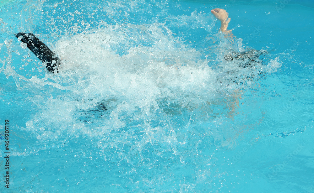 Jumping child in swimming pool 