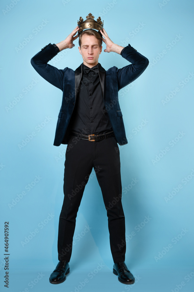 Crown yourself, a successful young businessman with a crown over head. Crown yourself, a successful young businessman with a crown over head.