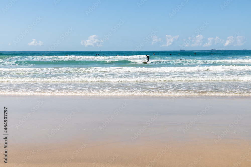 Surfers on the waves