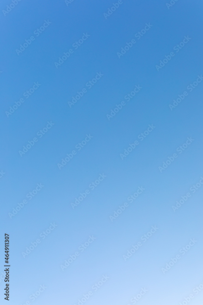 clear blue sky. gradient from dark to light. vertical clear blue sky. gradient from dark to light. vertical