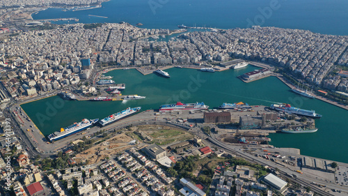 Aerial drone photo of famous and busy port of Piraeus where passenger ferries travel to Aegean destination islands as seen from high altitude , Attica, Greece photo