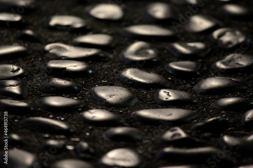 Photography Light and shadows on traditional Japanese smooth pebble flooring macro with sele