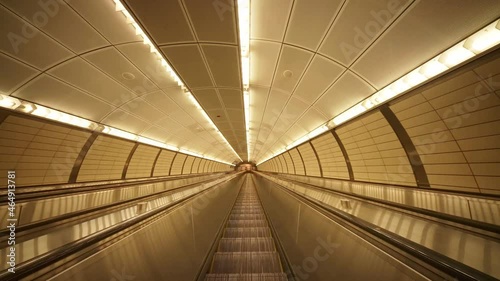Empty New York subway escalator. Manhattan, New York City metro. Concept of NYC as urban lifestyle, tourism destination in America, modern city USA. photo
