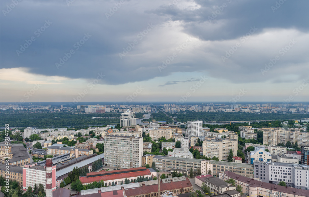 Fototapeta premium Beautiful panorama of the city center of Kiev and the Pechersk district from a height. View of the left bank and overhanging rain clouds