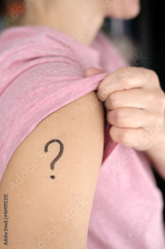 Wallpaper Mural Shoulder with a drawn question mark. Concept of uncertainty, whether or not to vaccinate against covid-19 and which vaccine to choose.  Torontodigital.ca