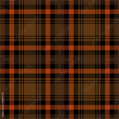Orange, brown and black tartan plaid. Scottish pattern fabric swatch close-up. 